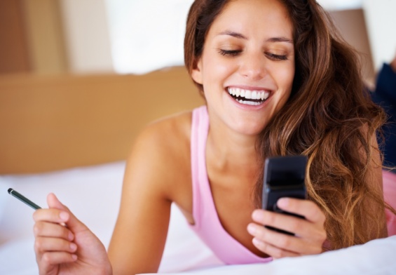 Beautiful woman reading text message