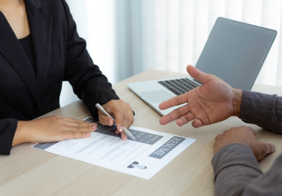 Male job applicants are explaining in detail their work history and Talent to job interviewers writt