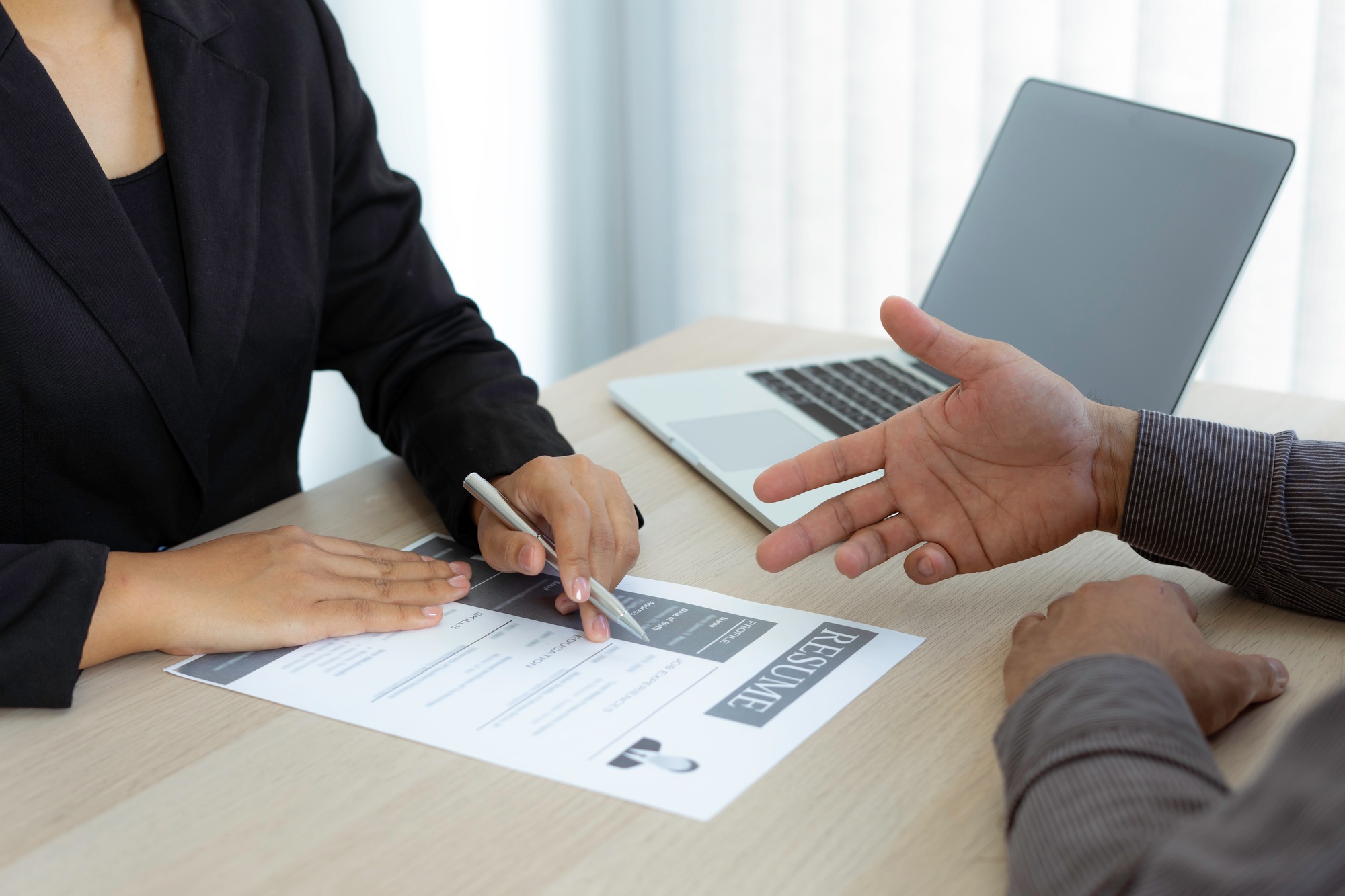 Male job applicants are explaining in detail their work history and Talent to job interviewers writt