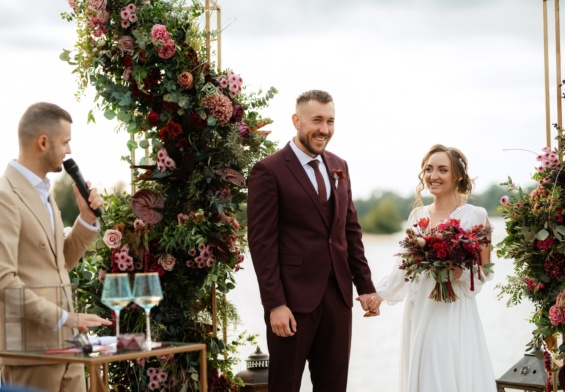 wedding ceremony of the newlyweds on the pier